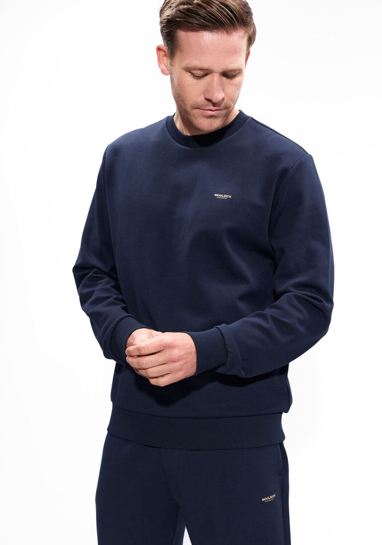 donkerblauwe woolrich trui logo interlock crewneck