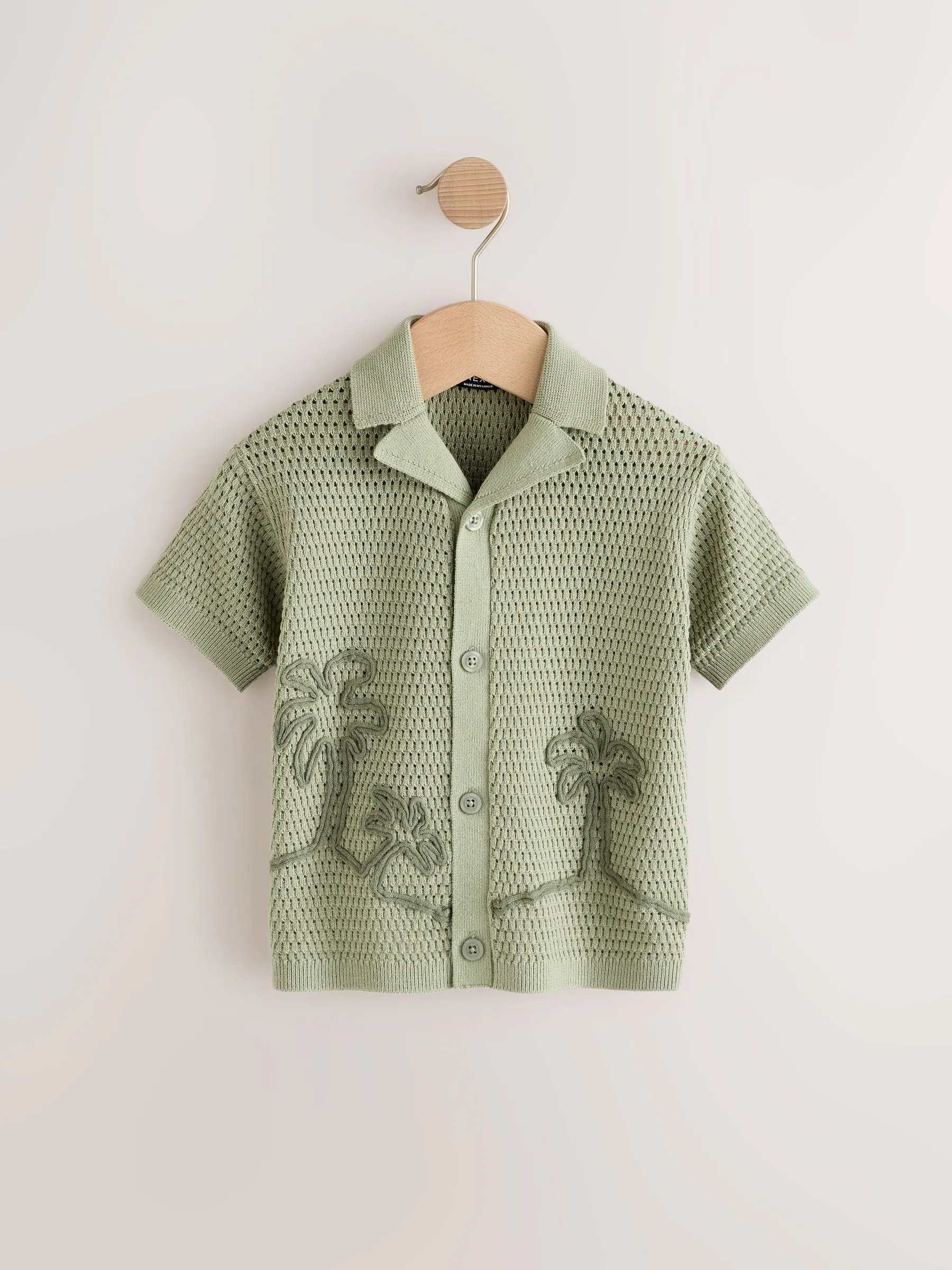 Groen met palmenprint - Gebreid poloshirt met reverskraag en korte mouwen met textuur (3mnd -7jr)