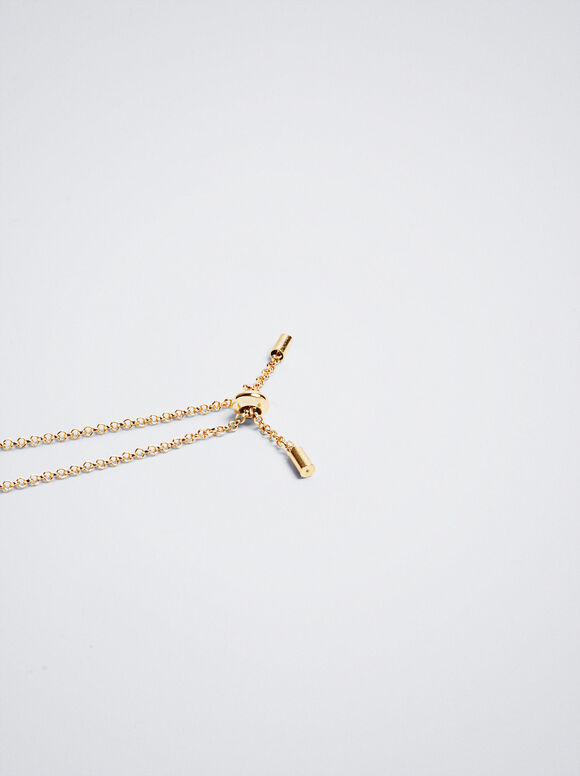 Pulseira dourada com cristal e concha - Dourada