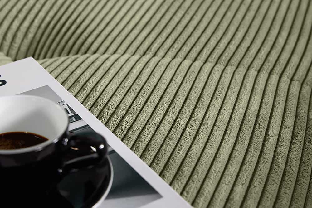 Modernes Ecksofa KENT 220cm grün Cord inkl. Hocker Federkern L-Form Wohnlandschaft