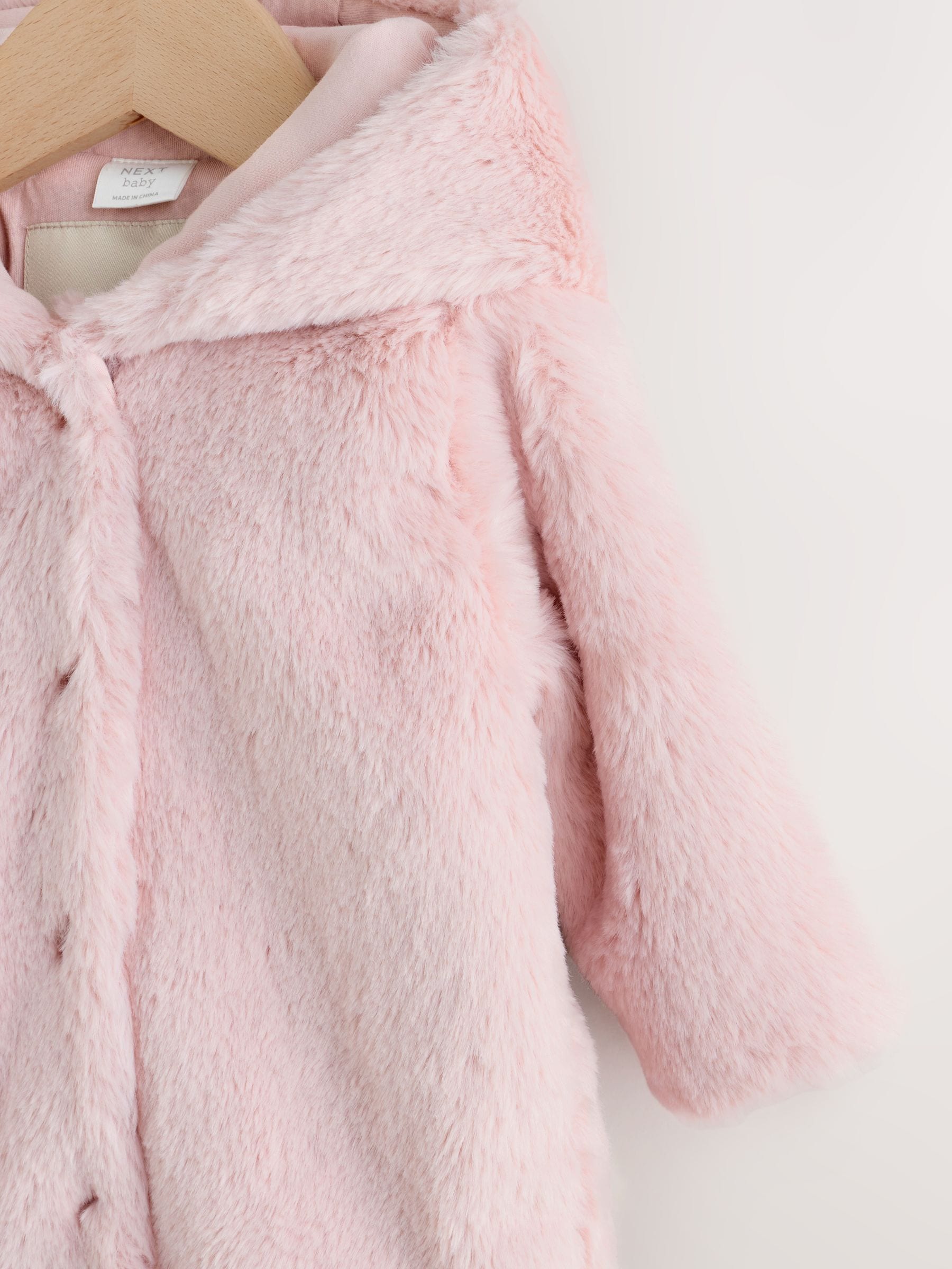 Roze - Babyjack met capuchon van imitatiebont (0mnd -2jr)