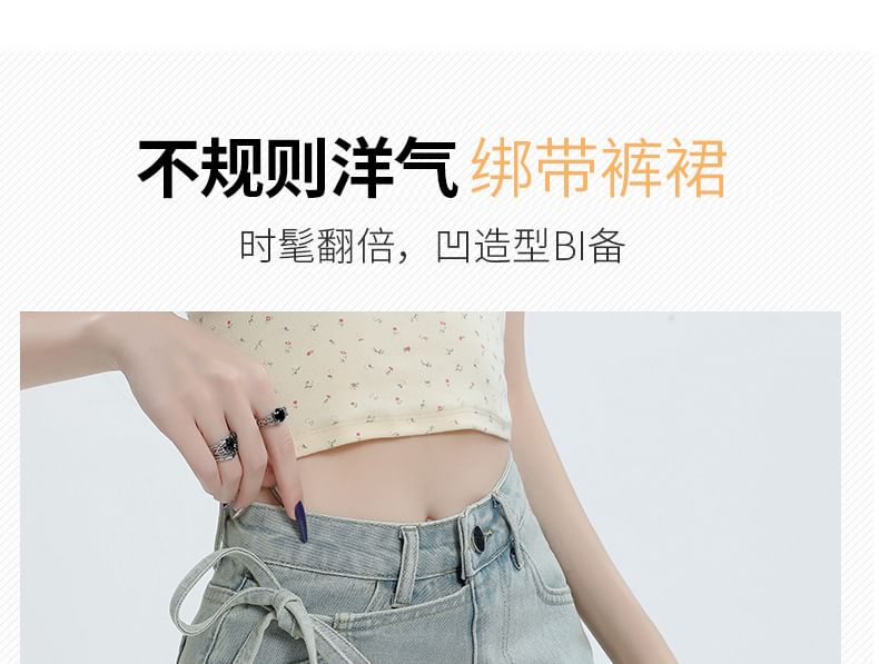Denimot - Hoge taille asymmetrische gewassen mini A-lijn denim skort met strik aan de zijkant