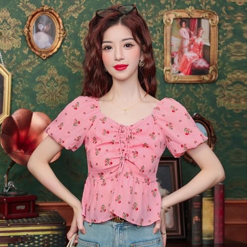 Bornite - Blouse met pofmouwen, V-hals, bloemenprint en trekkoord, peplum