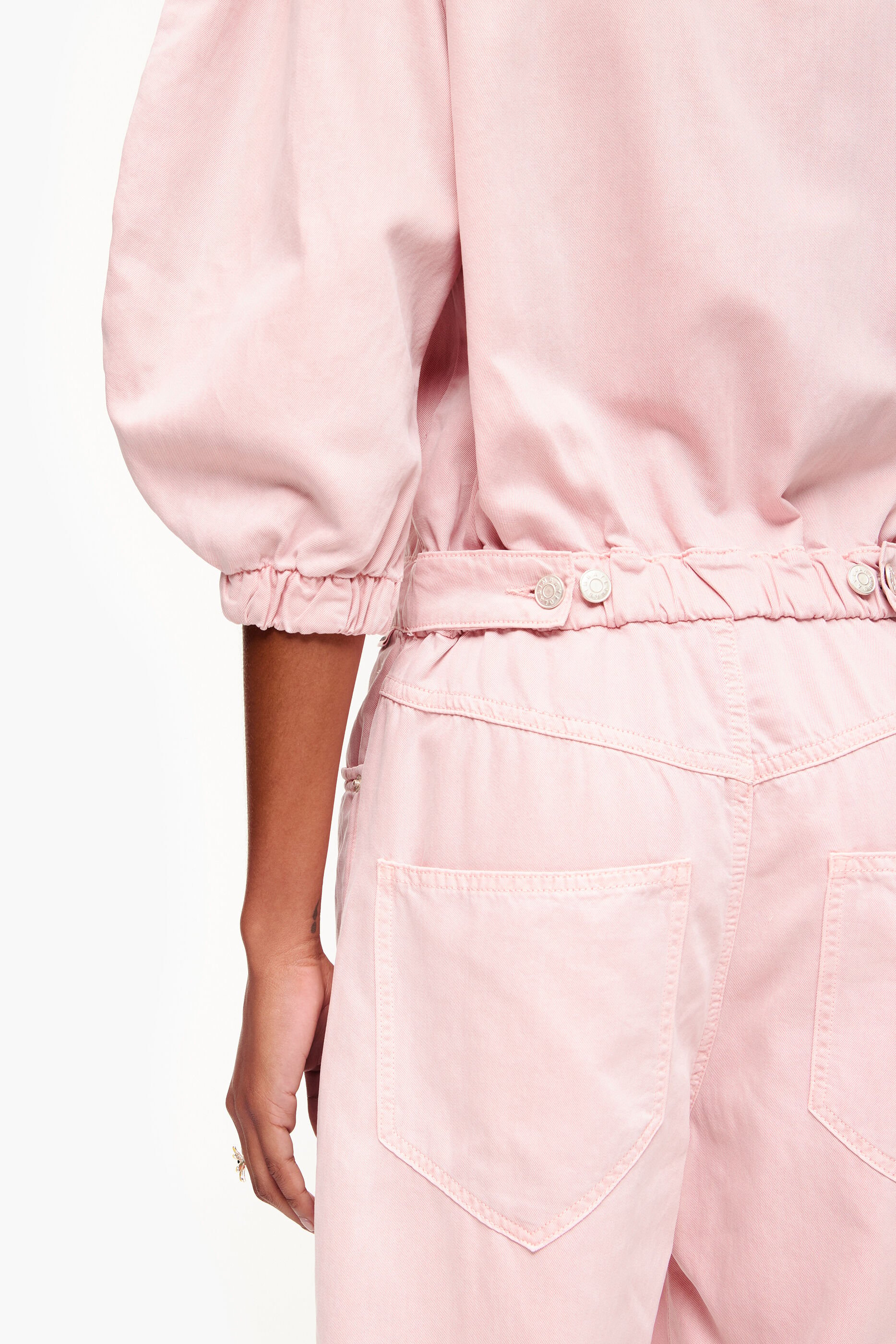 Macacão jeans rosa claro