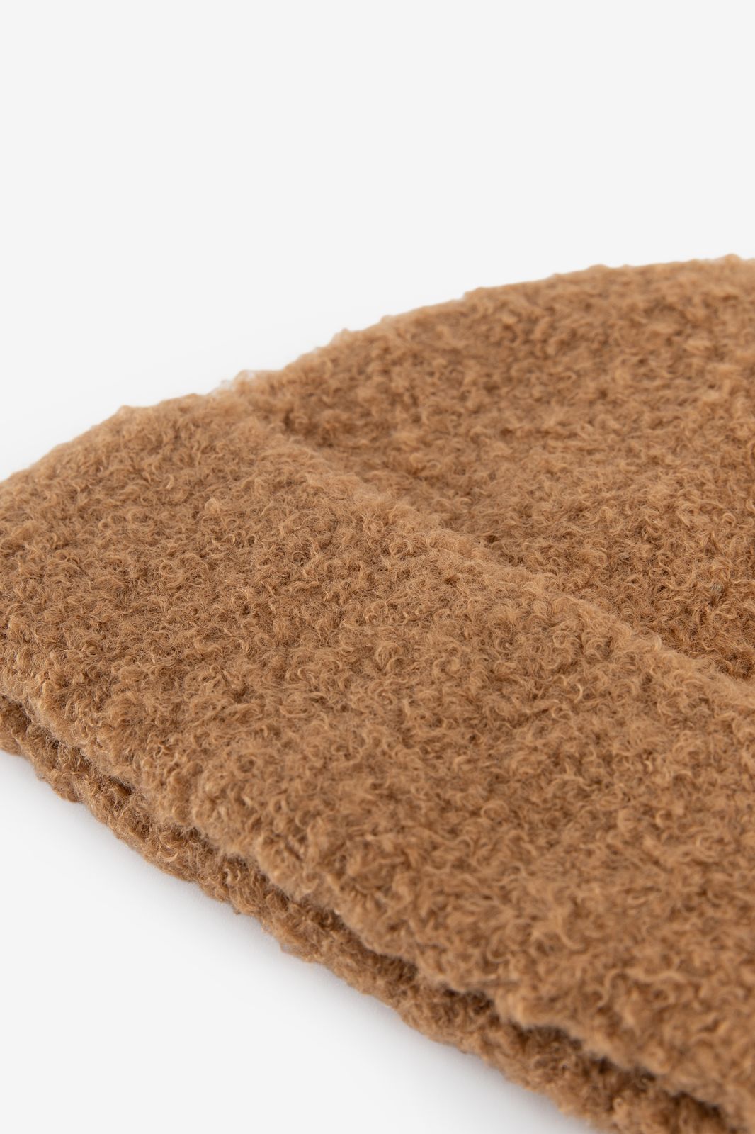 Bruine bouclé muts