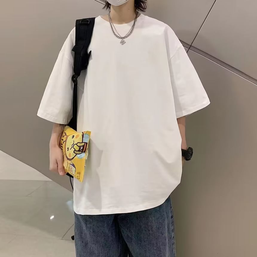 Femilina - Effen oversized T-shirt met ronde hals en elleboogmouwen
