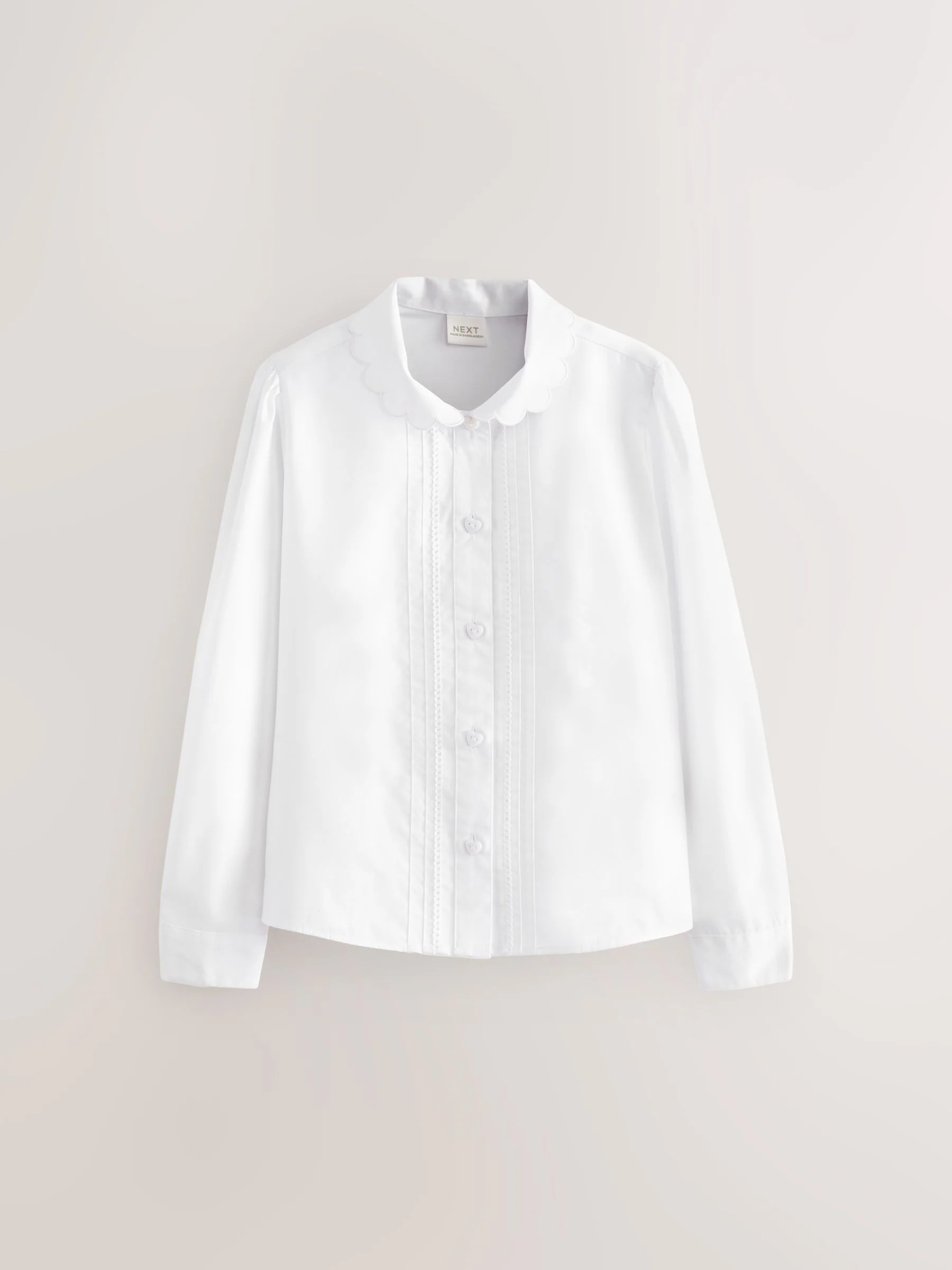 Wit - Schoolblouse met lange mouwen en gegolfde kantafwerking (3-14 jr)