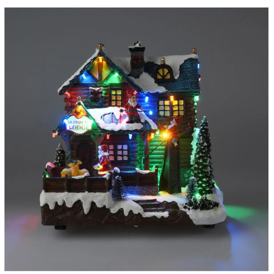 Kerstdorp huis - met beweging, licht en muziek -25 cm - poliresin