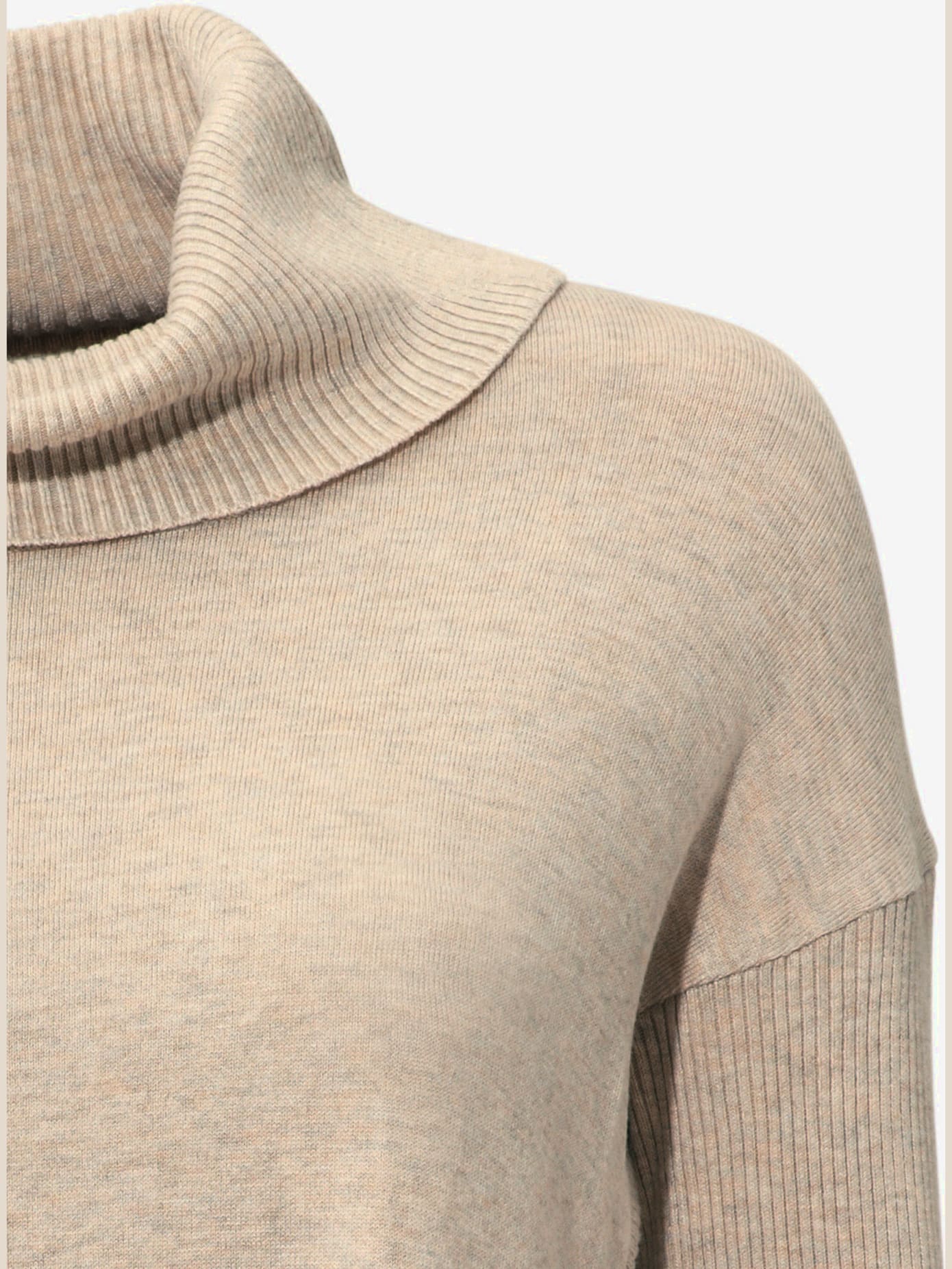 Pull col roulé style poncho tendance avec franges