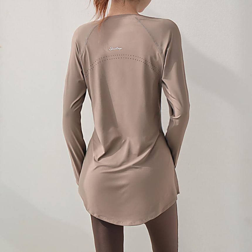 FAYE - Lange sporttop met lange mouwen en ronde zoom