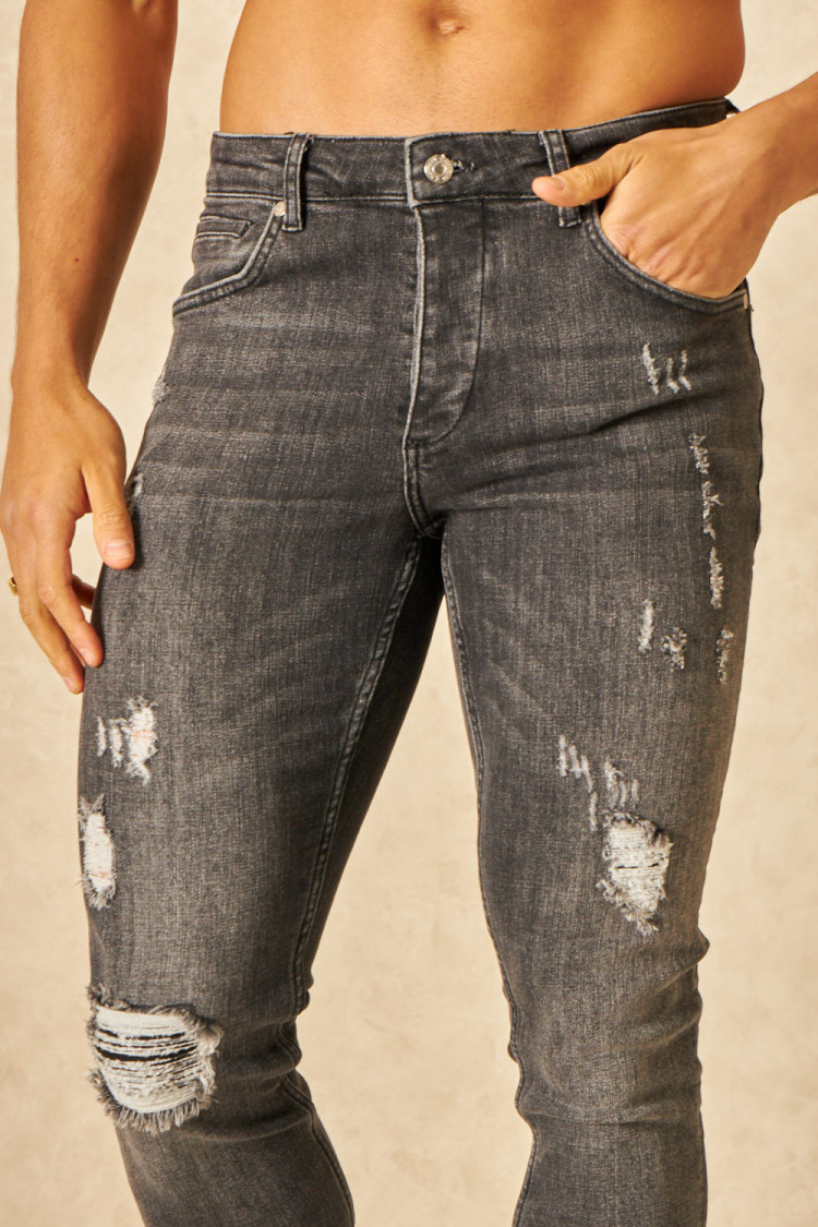 Jeans slim noir délavé déchiré