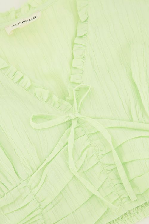 Groene crop top met ruffles en smock