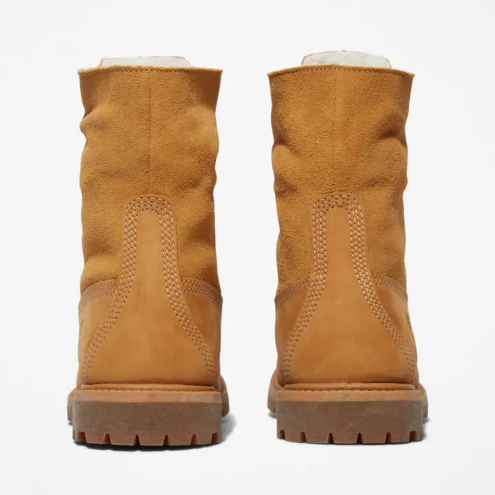 Bota Timberland Authentics impermeável com cano enrolável para mulheres, na cor amarela.