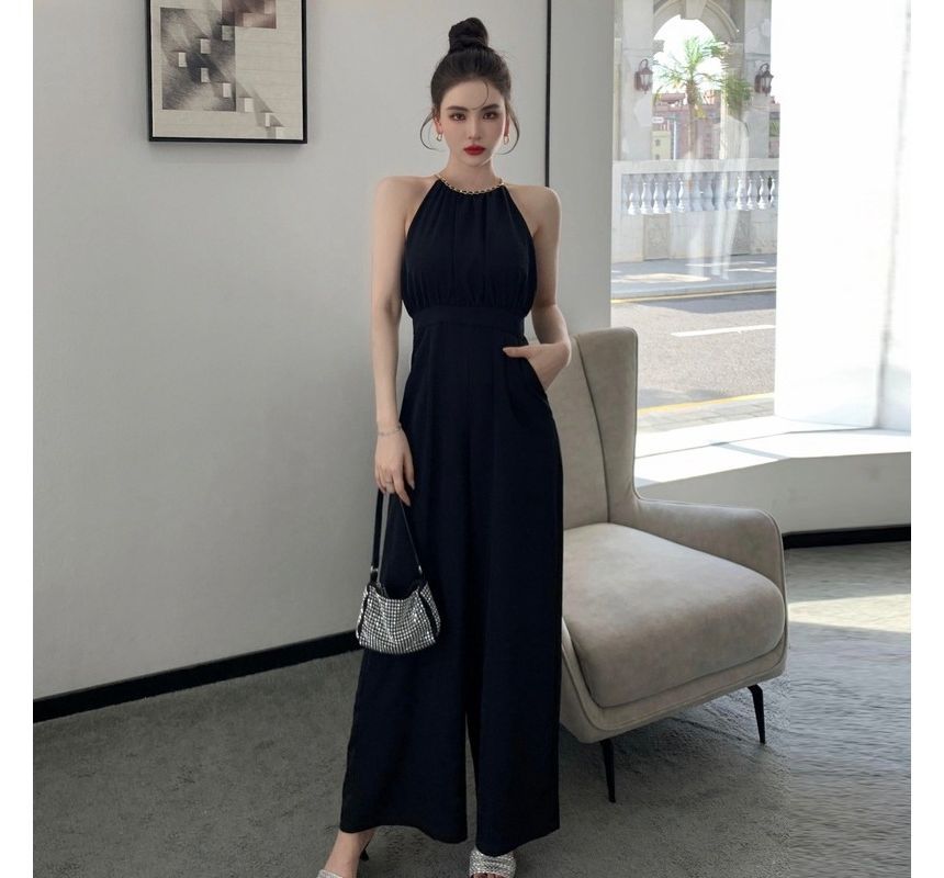 Yilda - Jumpsuit met spaghettibandjes en halterhals en wijde pijpen