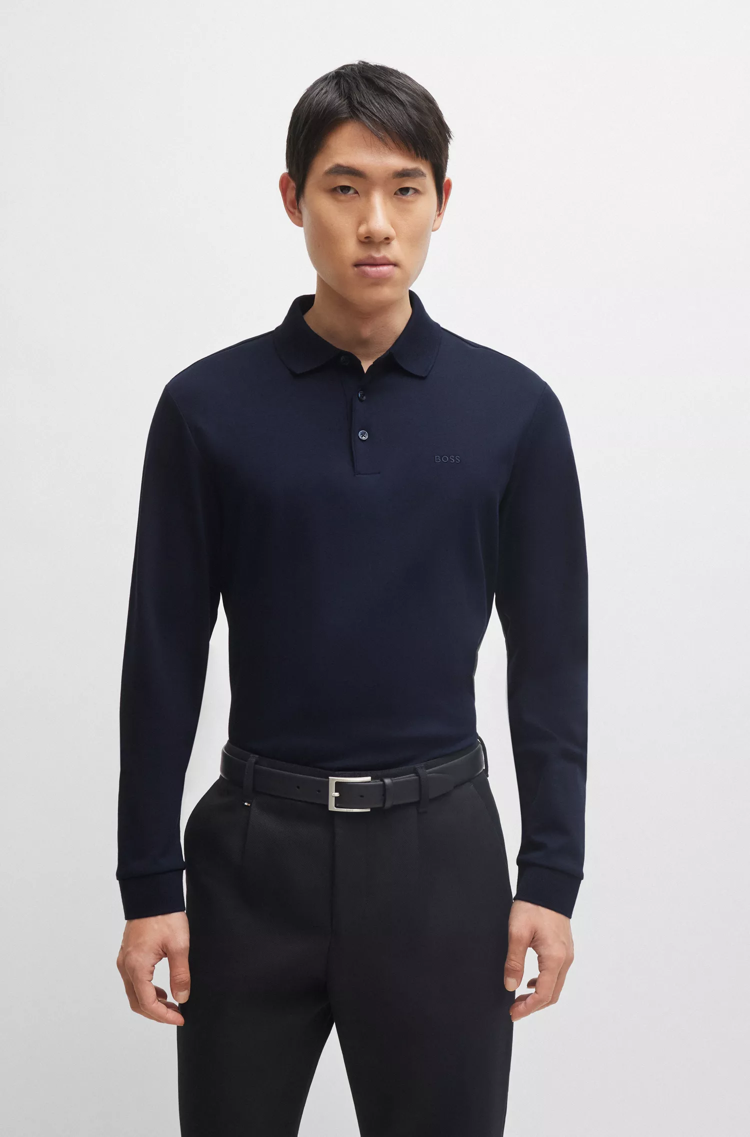 Camisa polo BOSS preta em algodão interlock com logotipo bordado.