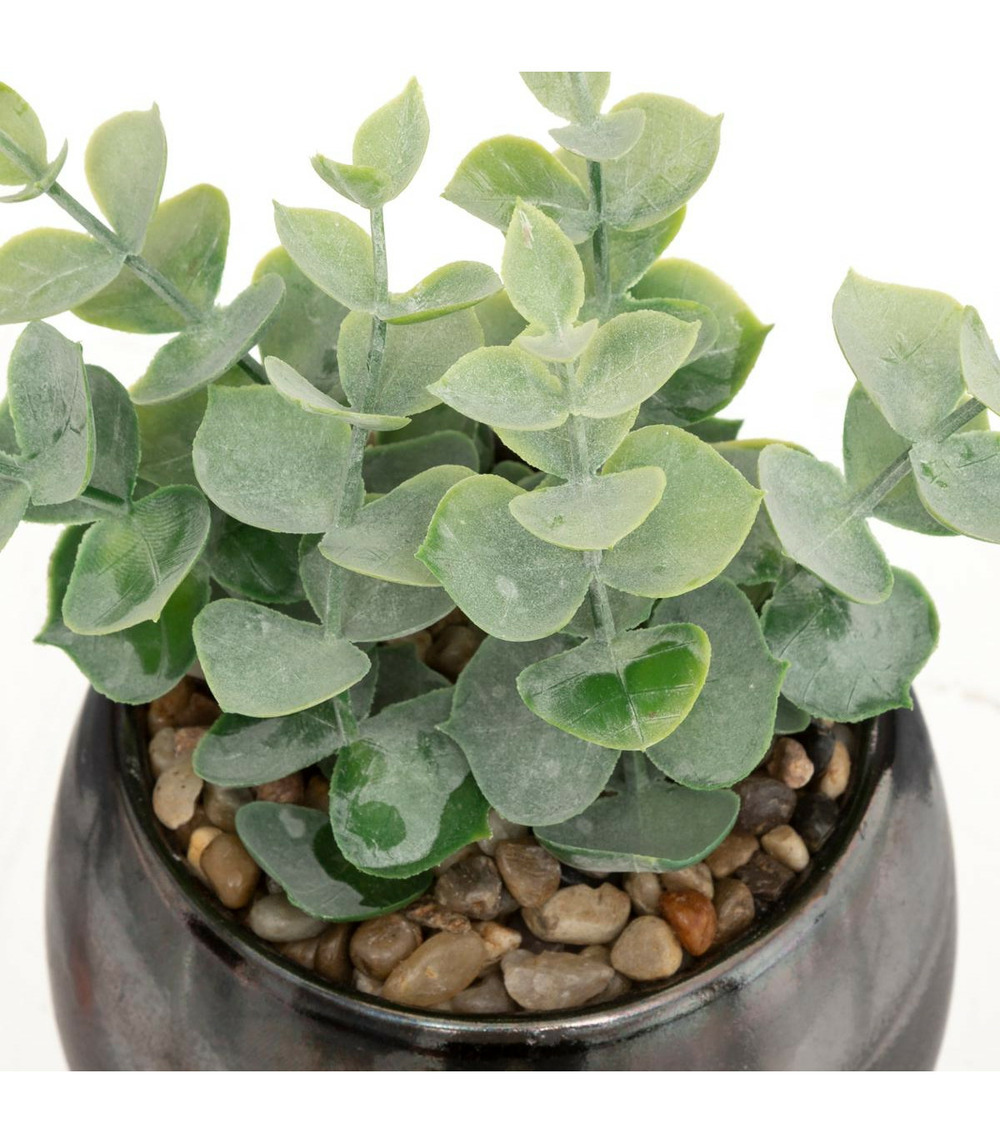 Plante artificielle dans un pot en céramique noire effet réactif