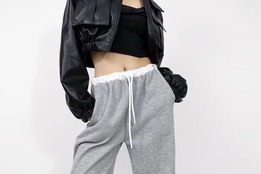 Asiris - Lage, contrasterende, losse joggingbroek met wijde pijpen