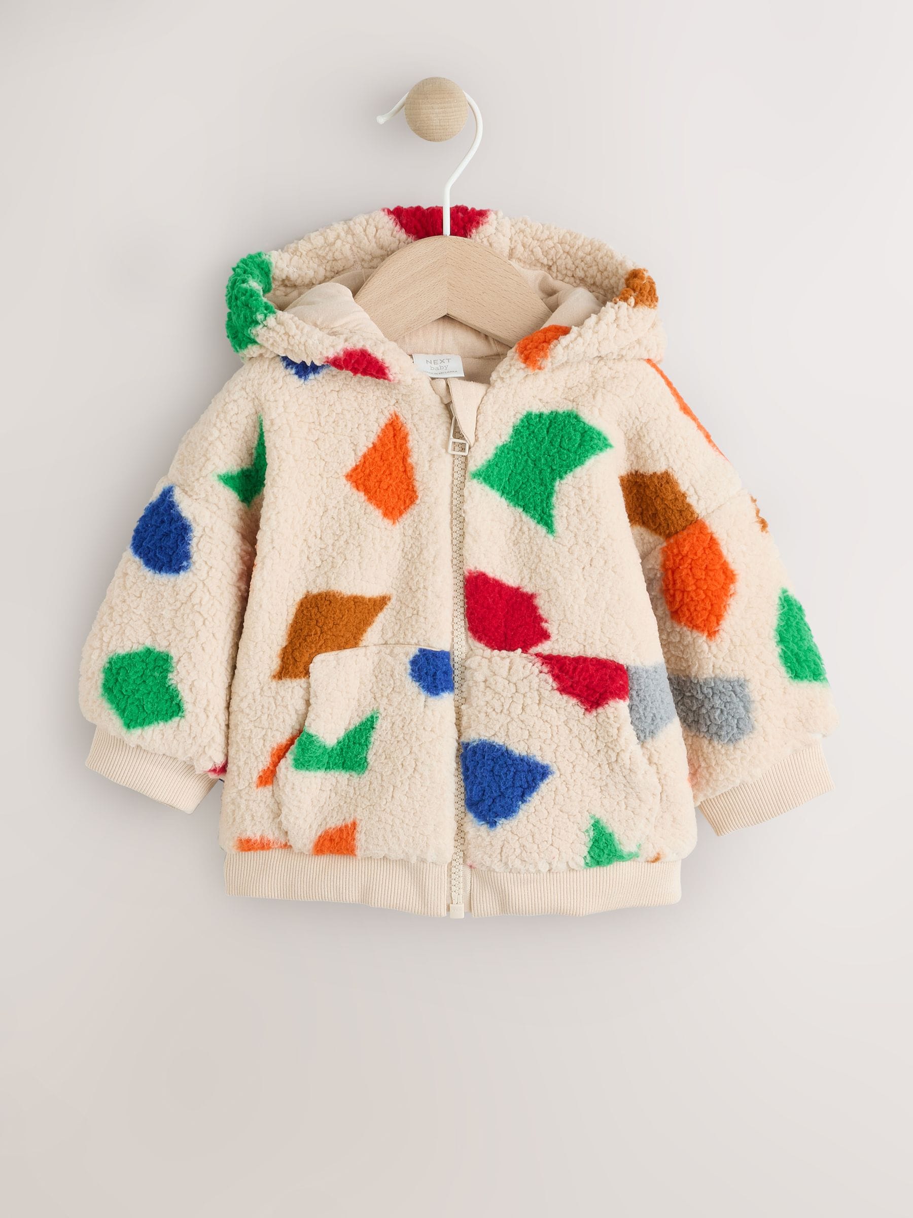 Natuurlijk felgekleurd met geometrische print - Babyjack met rits en capuchon (0mnd-2jr)