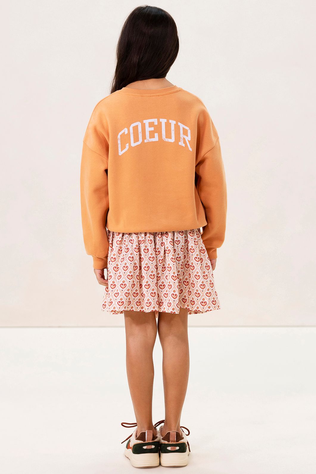 Lichtoranje oversized sweater met artwork