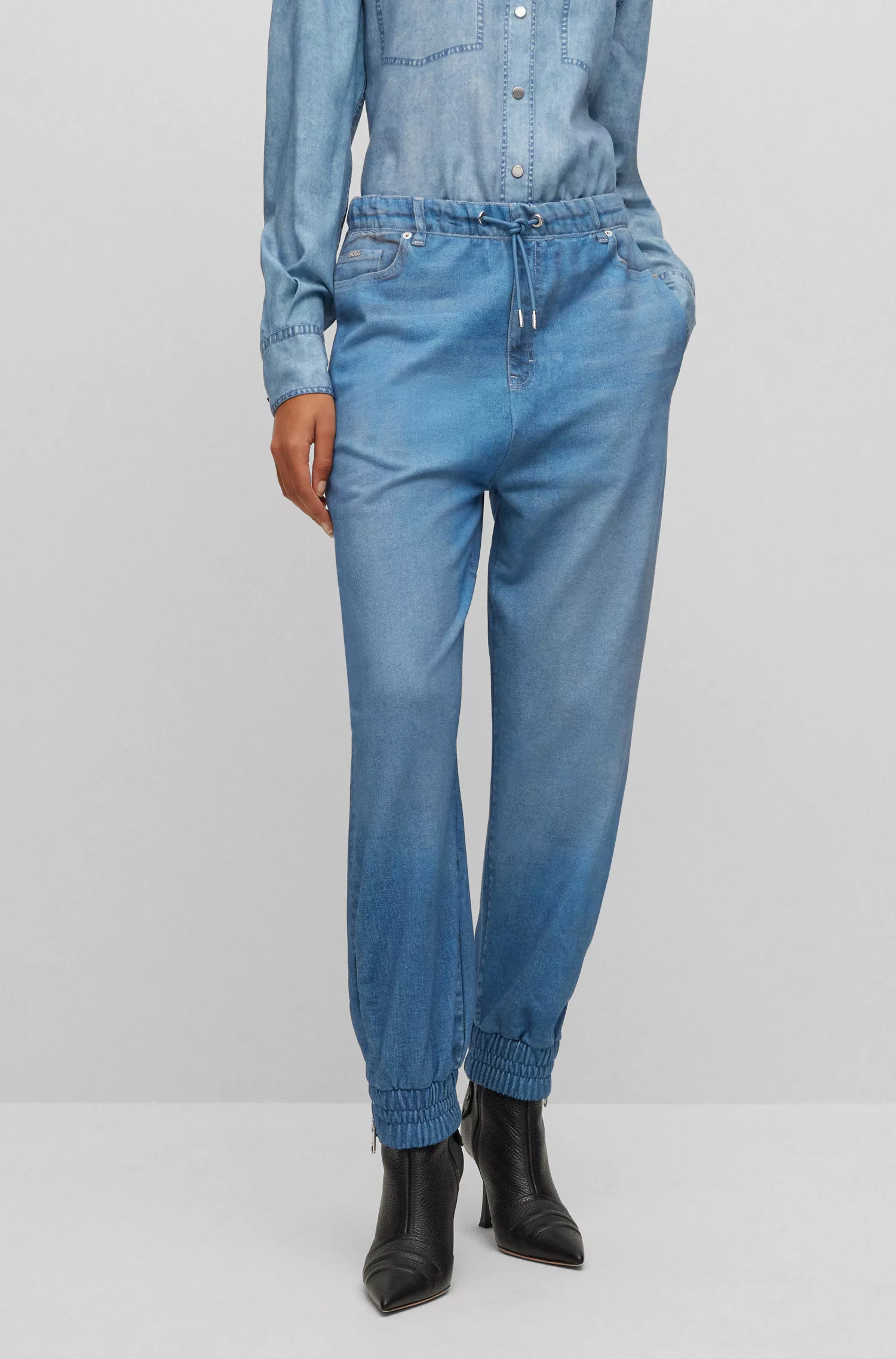 Calça de fato de treino BOSS preta em tecido atoalhado de algodão com estampa de efeito jeans.