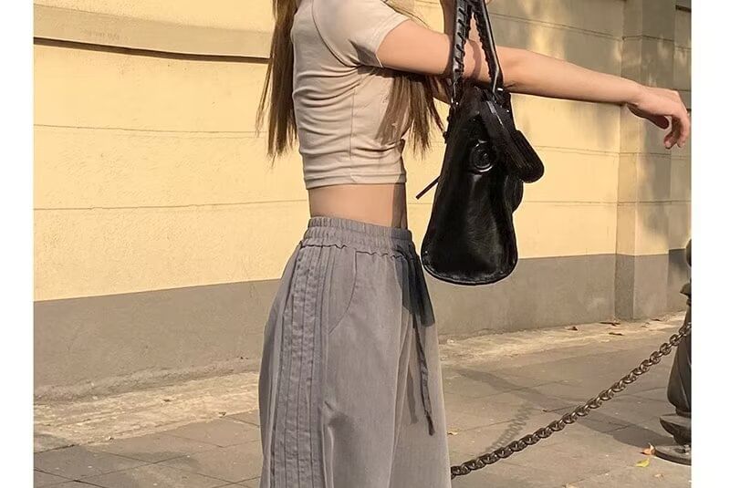 Rosesand - Hoge taille effen gestreepte losse wijde joggingbroek