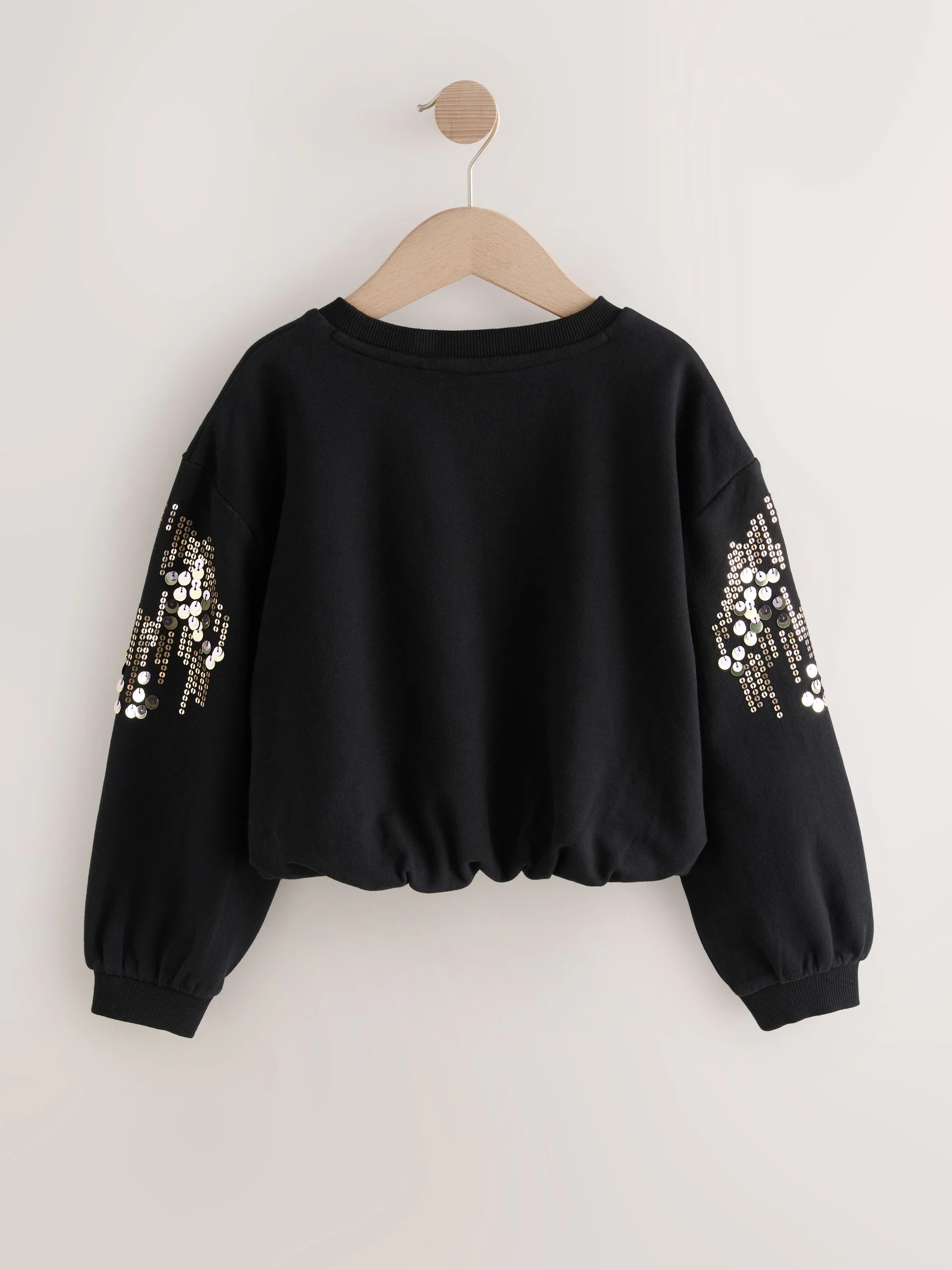Zwart - Sweatshirt met lange mouwen, pailletten en bolle zoom (3-16jr)