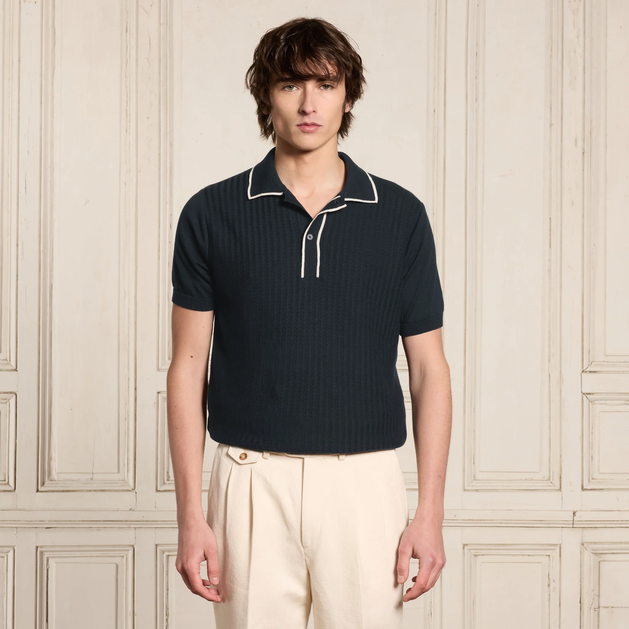 Navy and ecru knit polo shirt