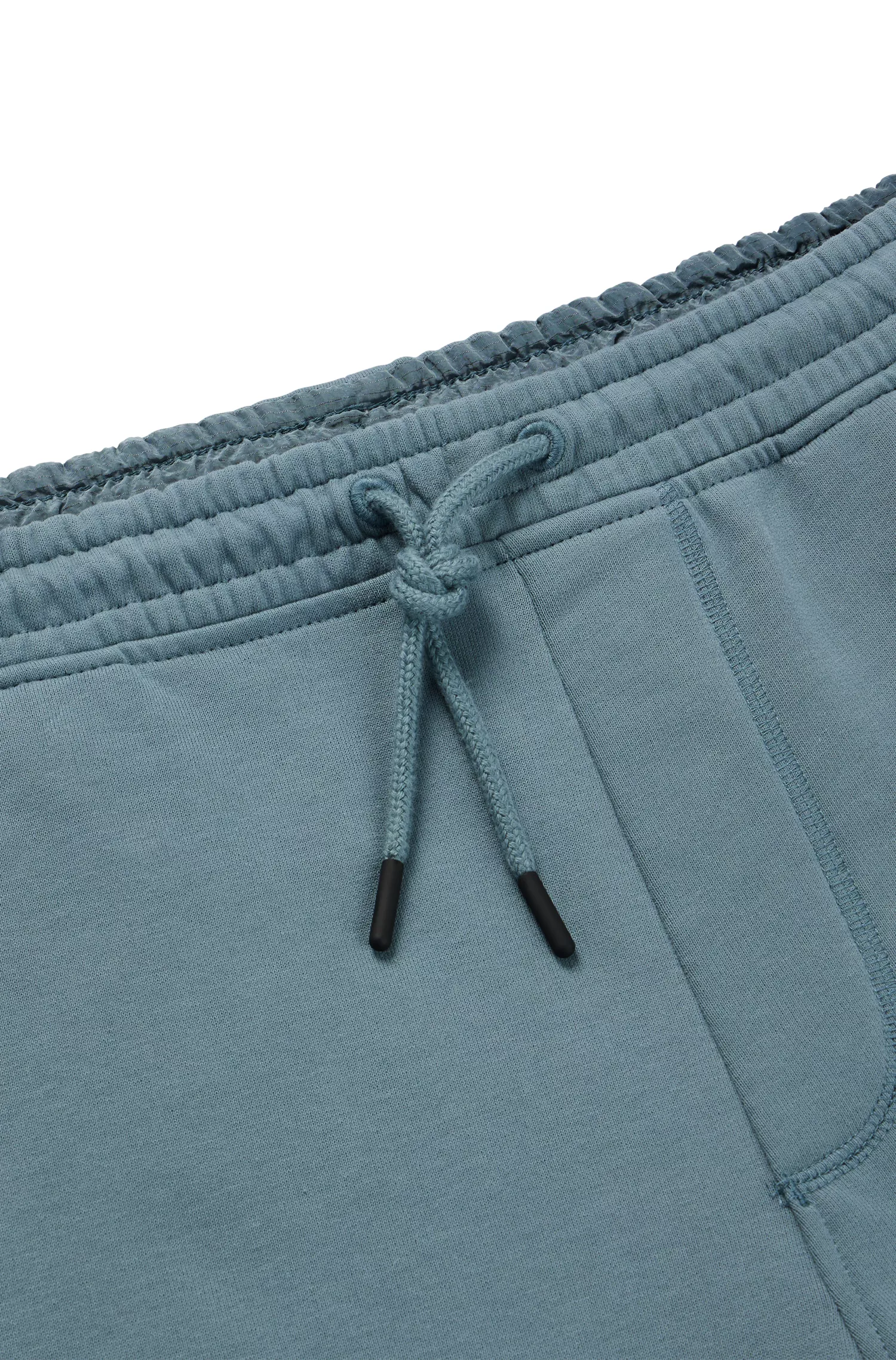 Calça de fato de treino BOSS laranja, corte regular, com bolsos cargo.