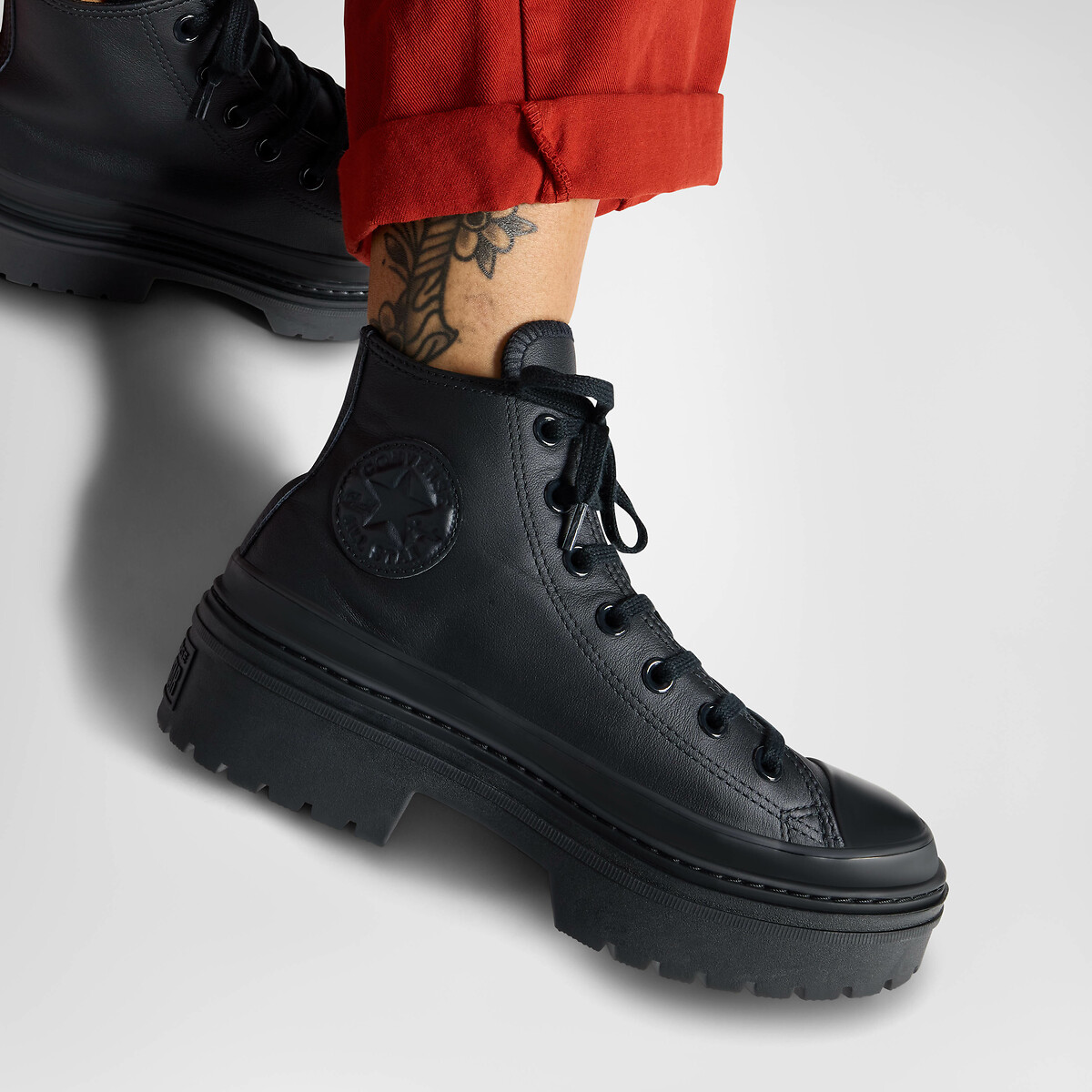 CONVERSE<br>Tênis All Star de couro com calcanhar tratorado