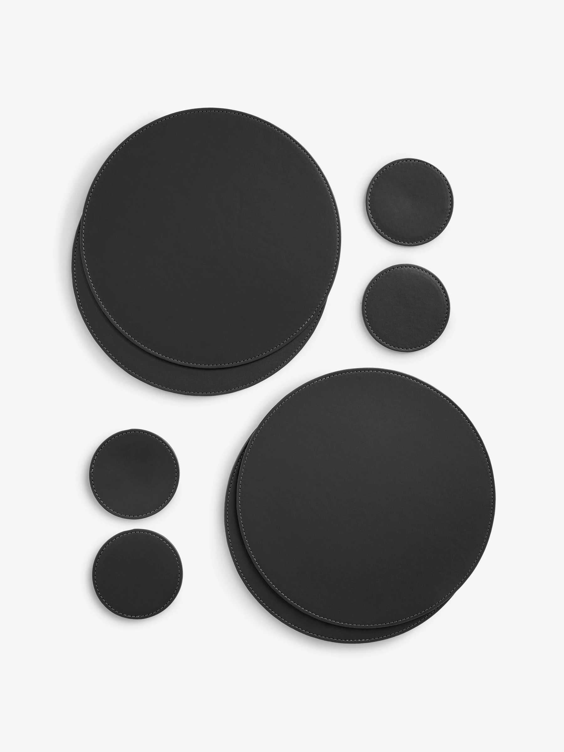 Set van 4 omkeerbare placemats en onderzetters van imitatieleer