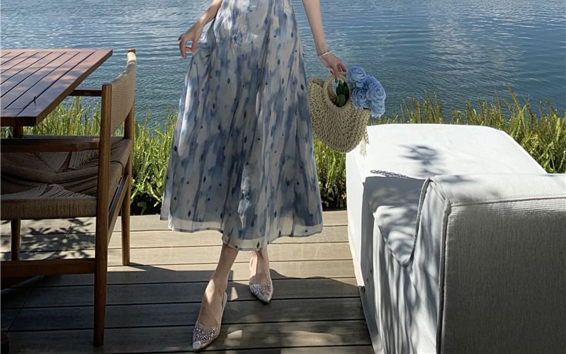 Yuxi - Midi-zonnejurk met halternek en bloemenprint