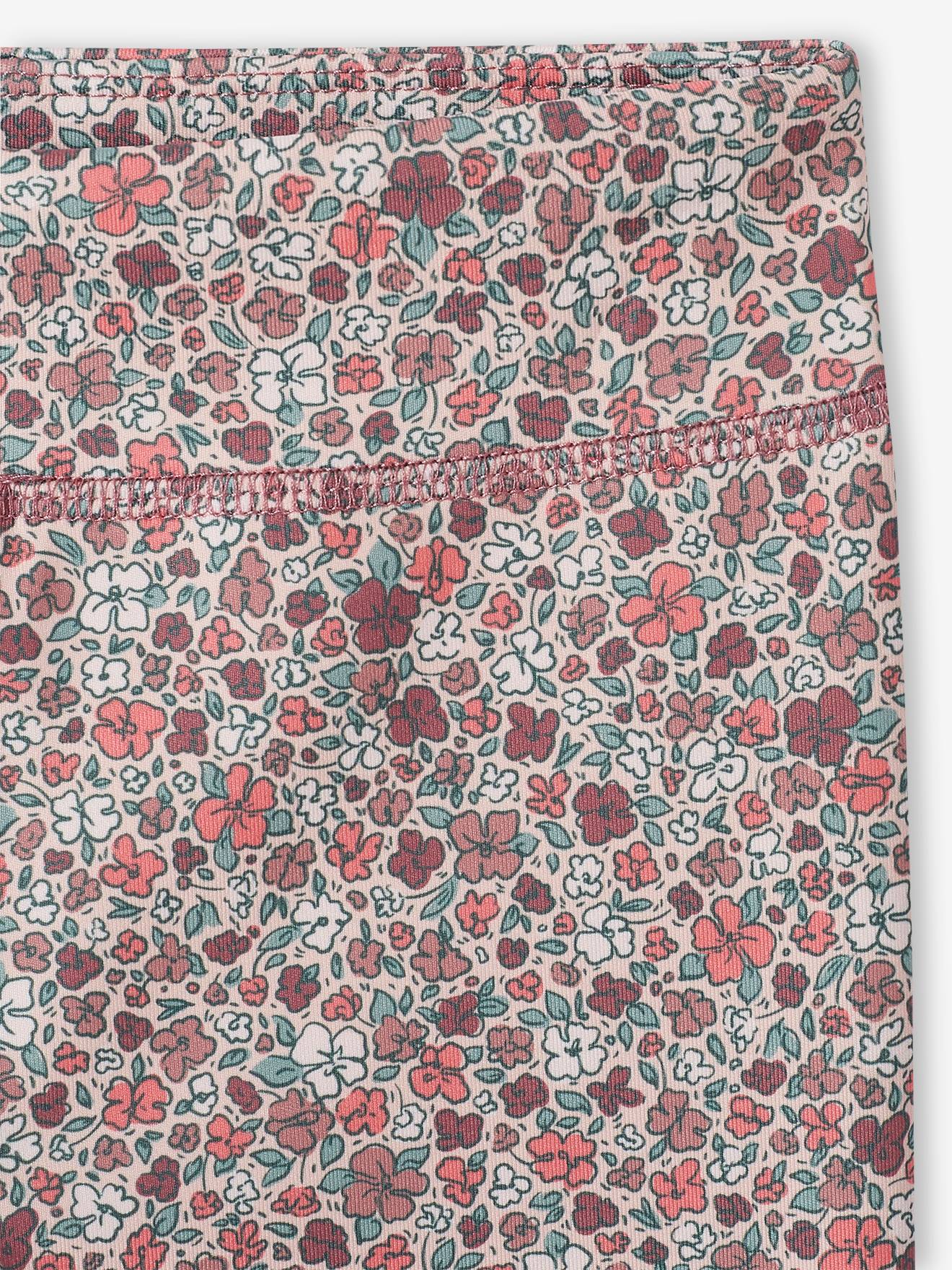 Leggings esportivas femininas em tecido técnico com estampa floral rosa.