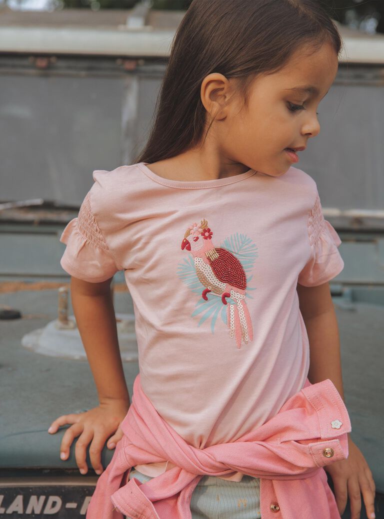 T-shirt rose pâle avec perroquet