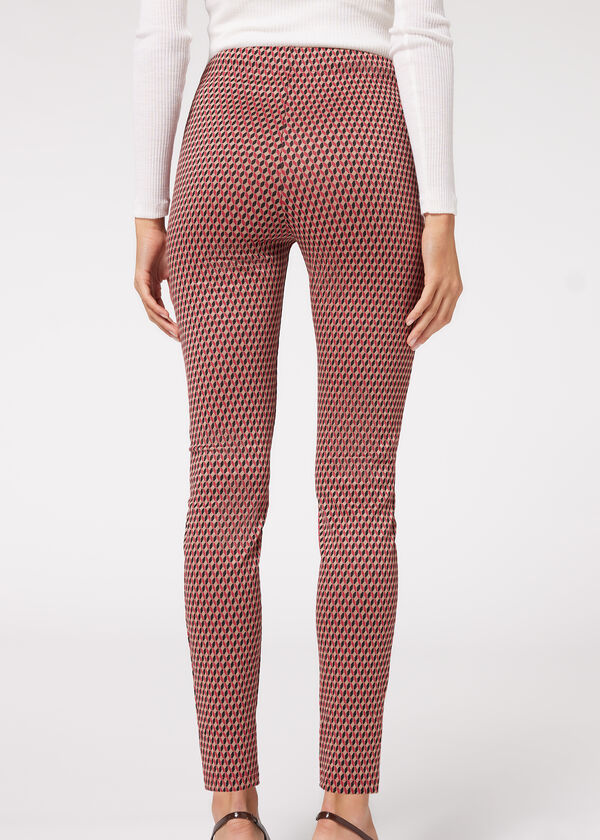 Calça legging skinny de malha elástica com zíper.