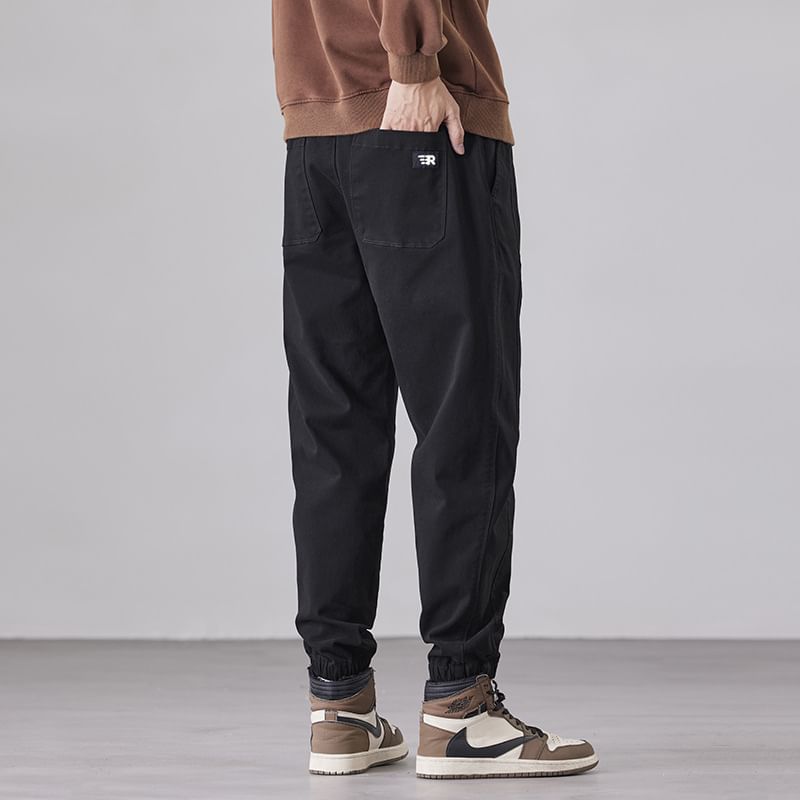 Andrei - Broek met trekkoord, applicatie en letters in de taille, taps toelopende pijpen