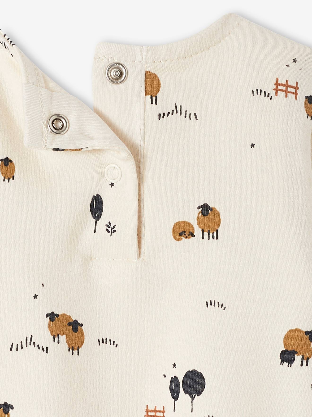 Camiseta/body de manga comprida para bebê com estampa de ovelhinha na cor natural.