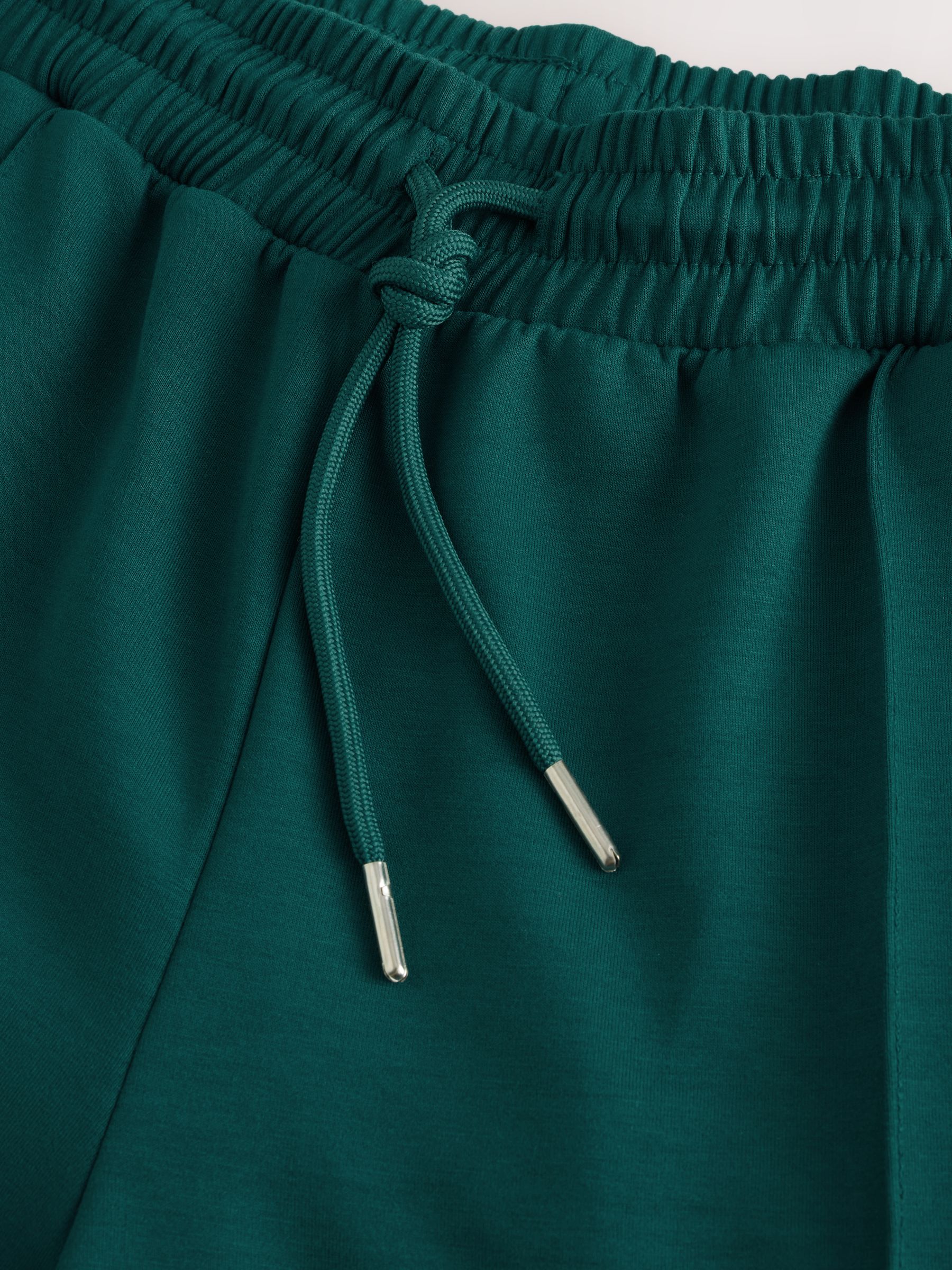Donkergroen - Slinky trainingsbroek met wijde pijpen en zijstrepen