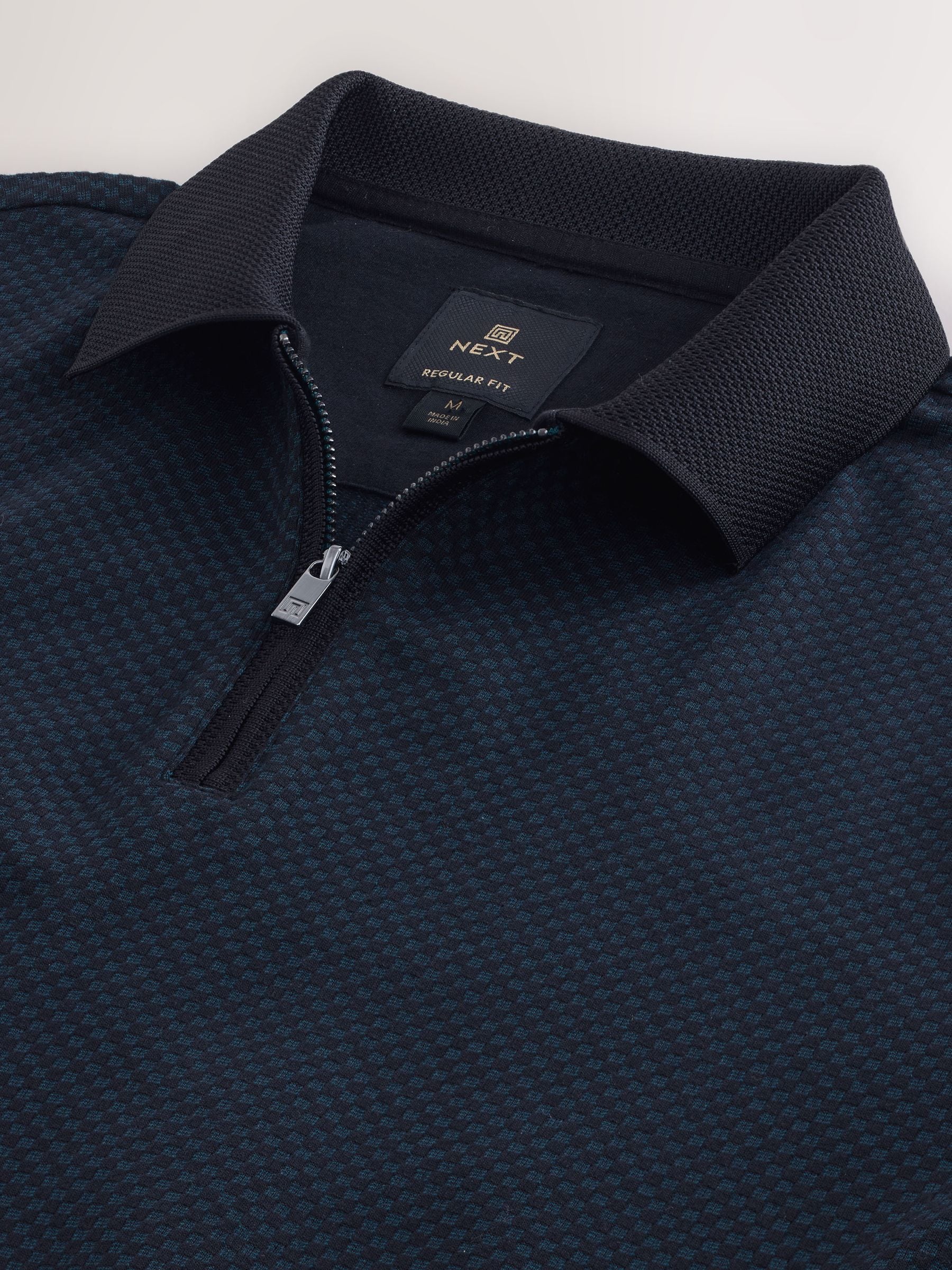 Blauwgroen - Modieus poloshirt met kwartrits