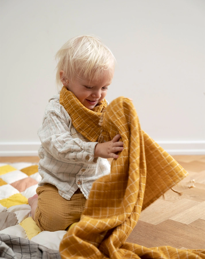 Babydecke GRID (80x110) mit Fransen in ochre