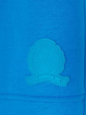 Calças de moletom com punho e patch de brasão