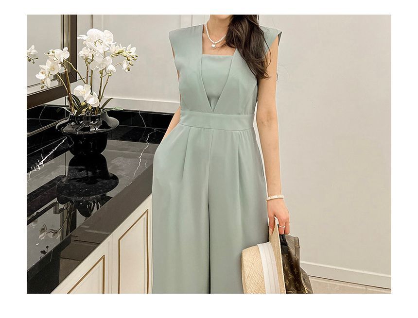 Arabesquito - Mouwloze jumpsuit met wijde pijpen en effen stof