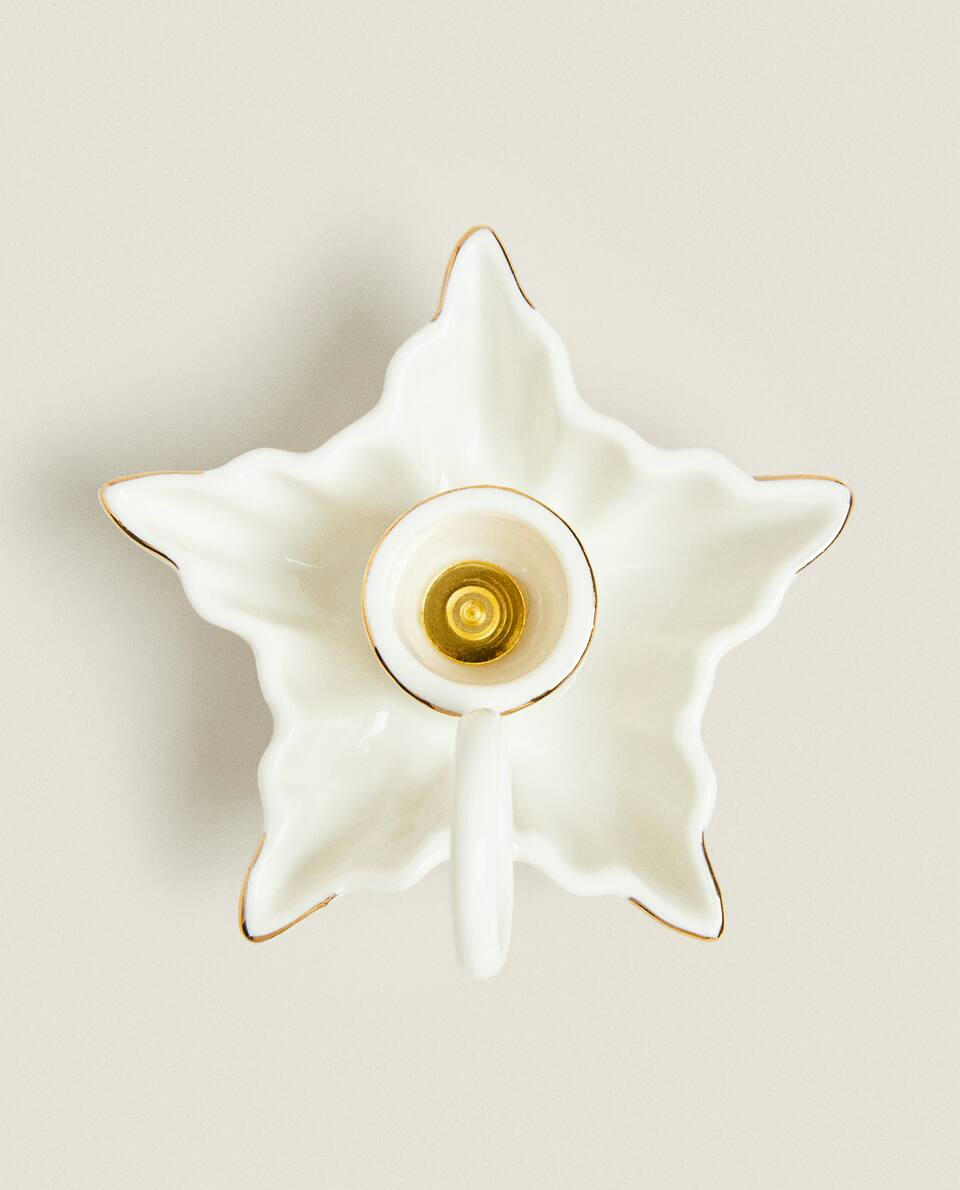 Castiçal em formato de estrela de Natal com borda
