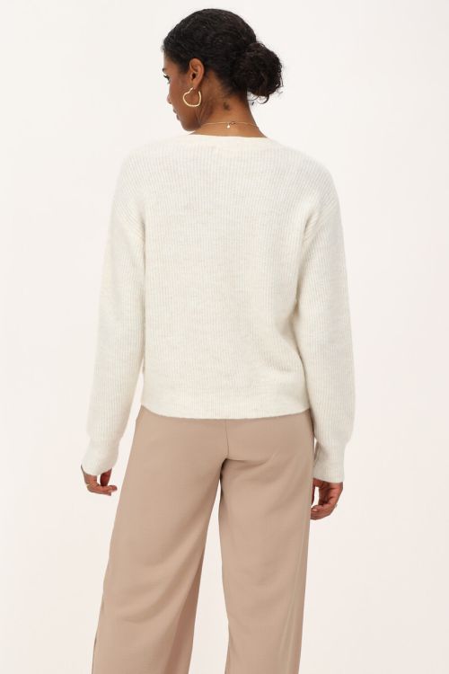 Crème vest met strikjes