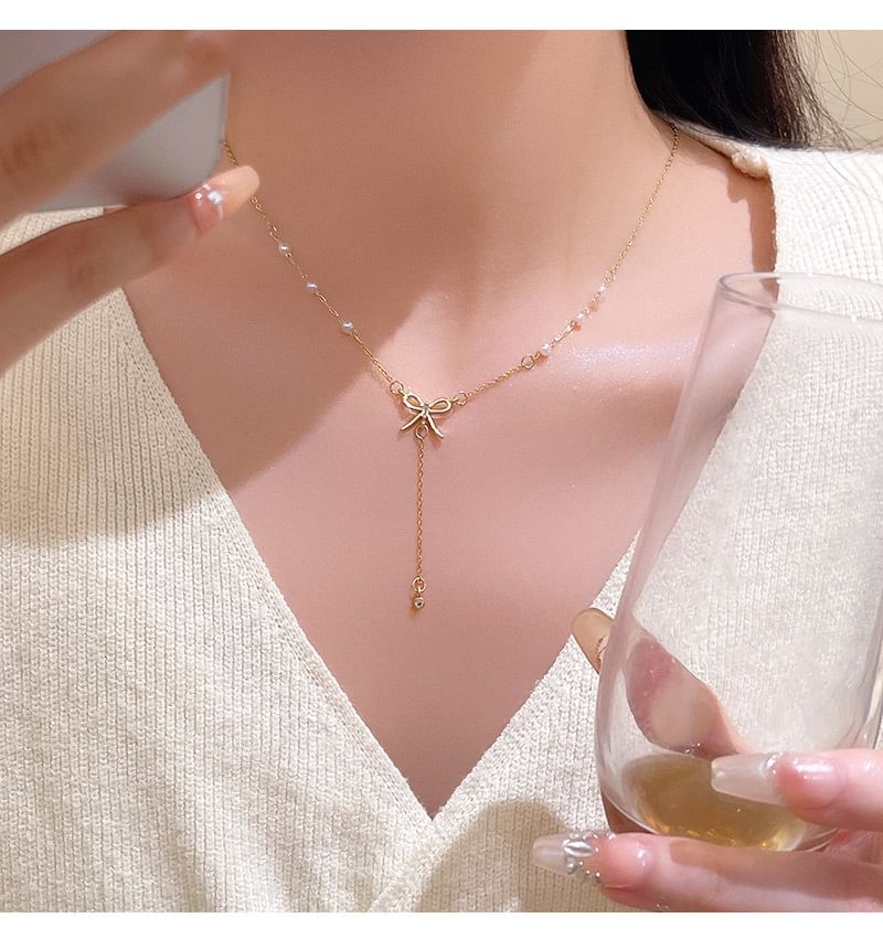LIVSIA - Ketting met strik en nepparels