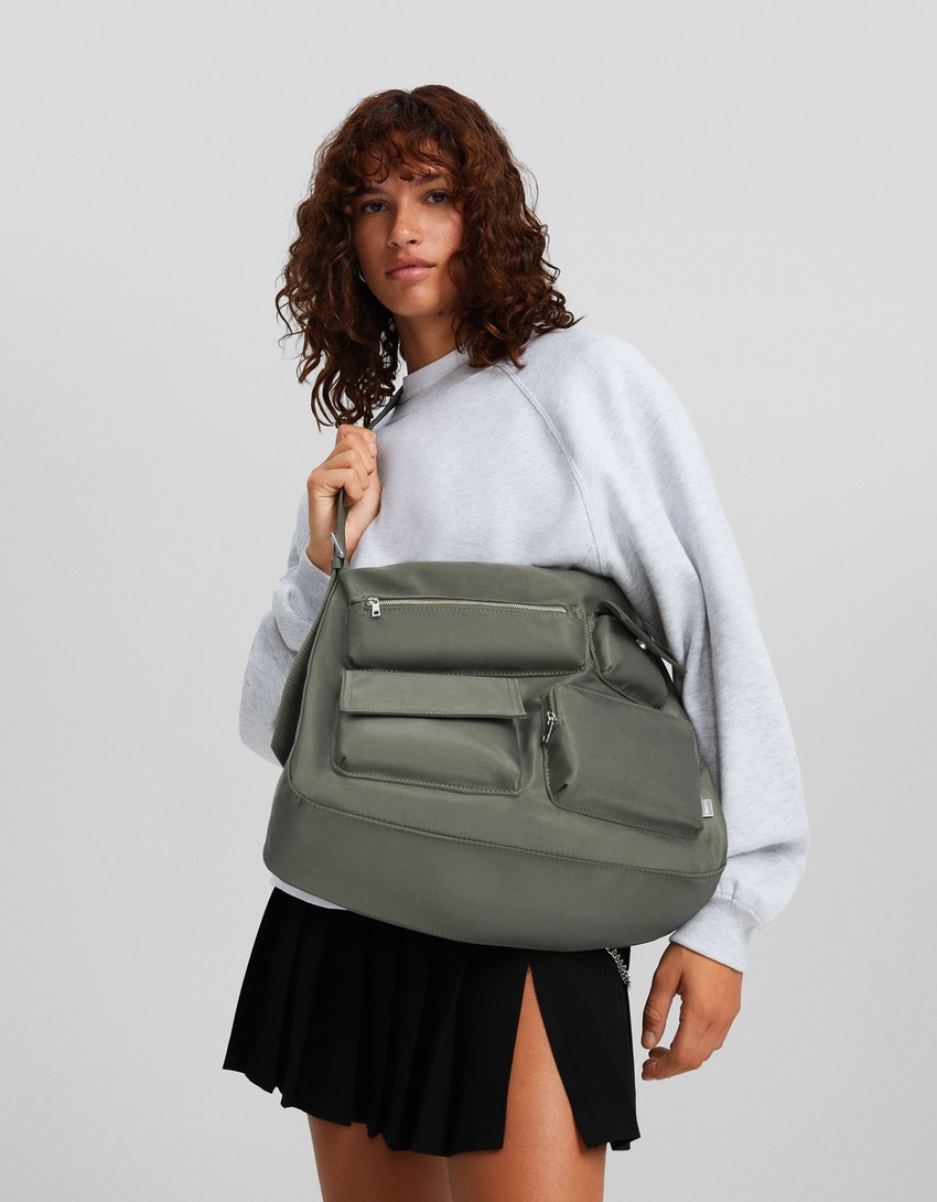 Bolsa transversal com vários bolsos