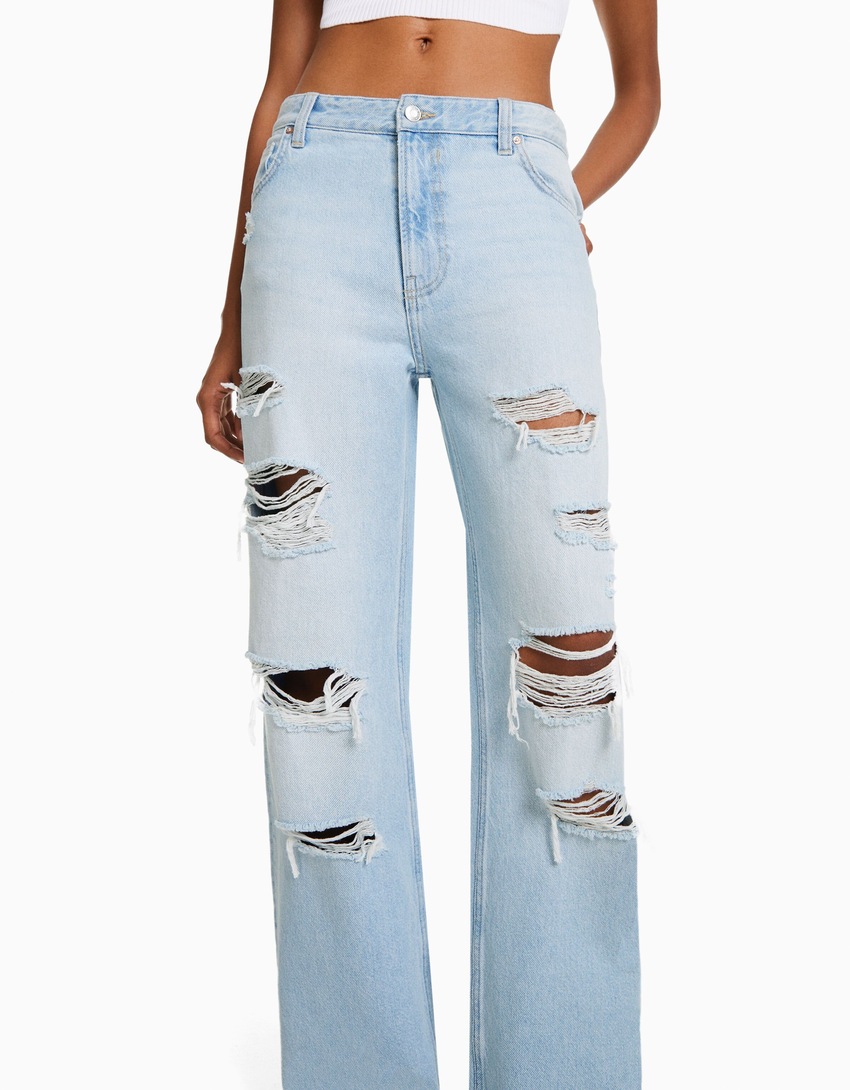 Calça jeans rasgada de perna larga dos anos 90