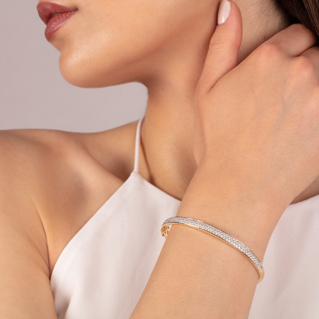 Armreif 750/18 K Gelbgold mit Diamanten 0.69 ct H/si