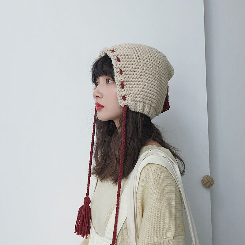 Combon - Gebreide muts met oorwarmer