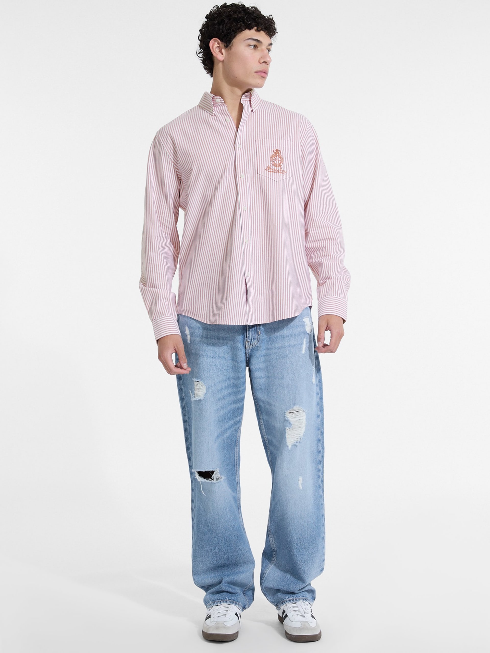 Camisa listrada de manga comprida com bolso