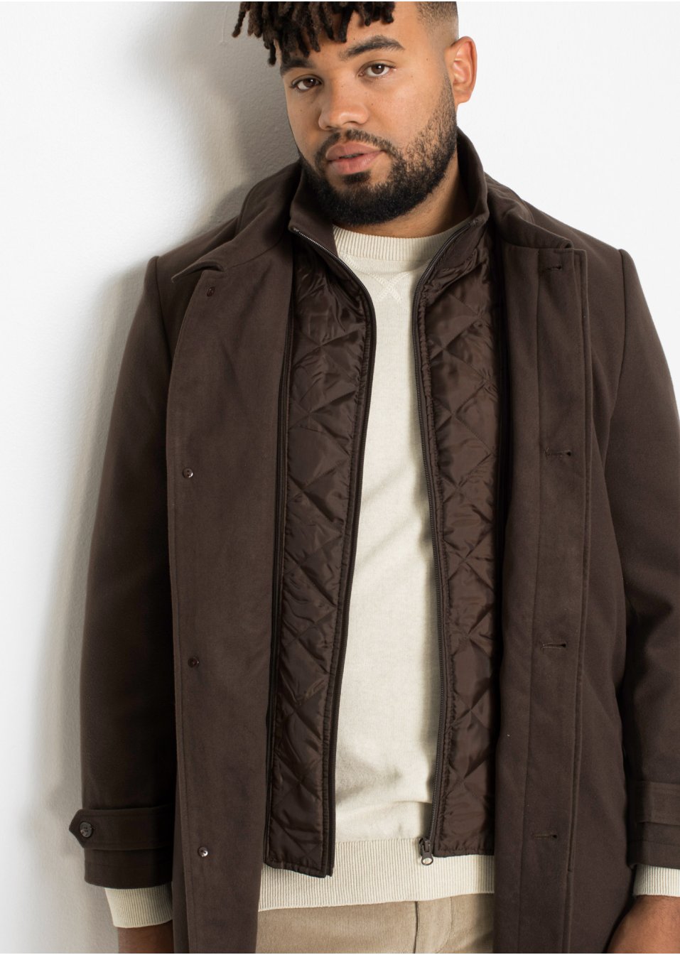 Manteau court avec empiècement coupe-vent